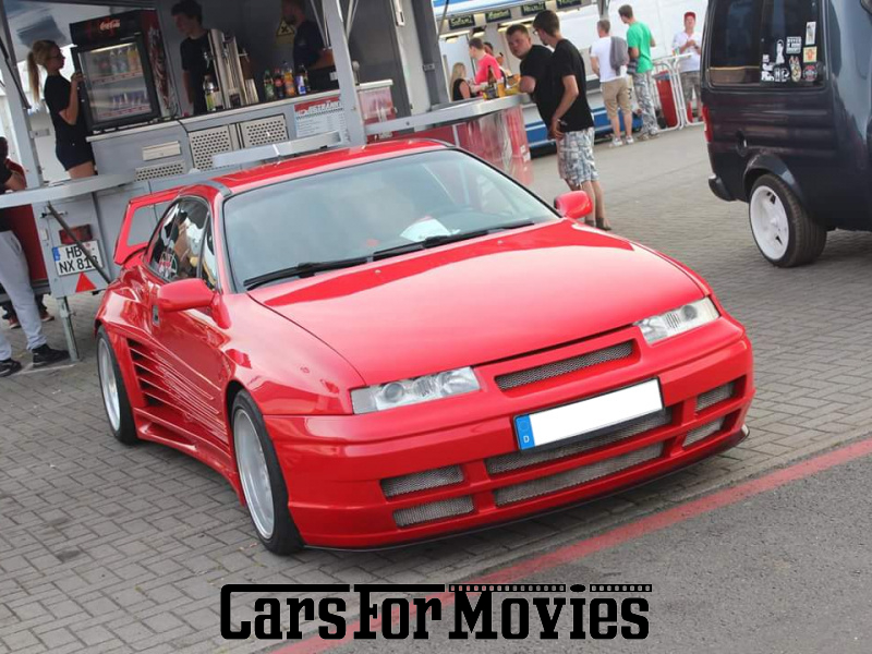 CarsForMovies | Opel Calibra Rieger Catano 1993 Deutschland Rot Schwarz Zivilfahrzeug Coupe Berlin 5251 Tuning Heckspoiler Frittentheke